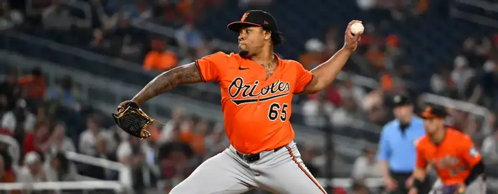 Baltimore Orioles pitcher mid-delivery during a high-pressure moment