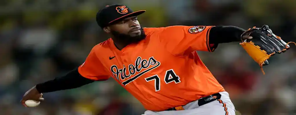 Baltimore Orioles vs New York Mets Picks and Predictions July 9th 2025 3 Baltimore Orioles pitcher winding up to deliver a pitch during a night game