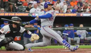 New York Mets batter swinging at the plate during a game against the Baltimore Orioles