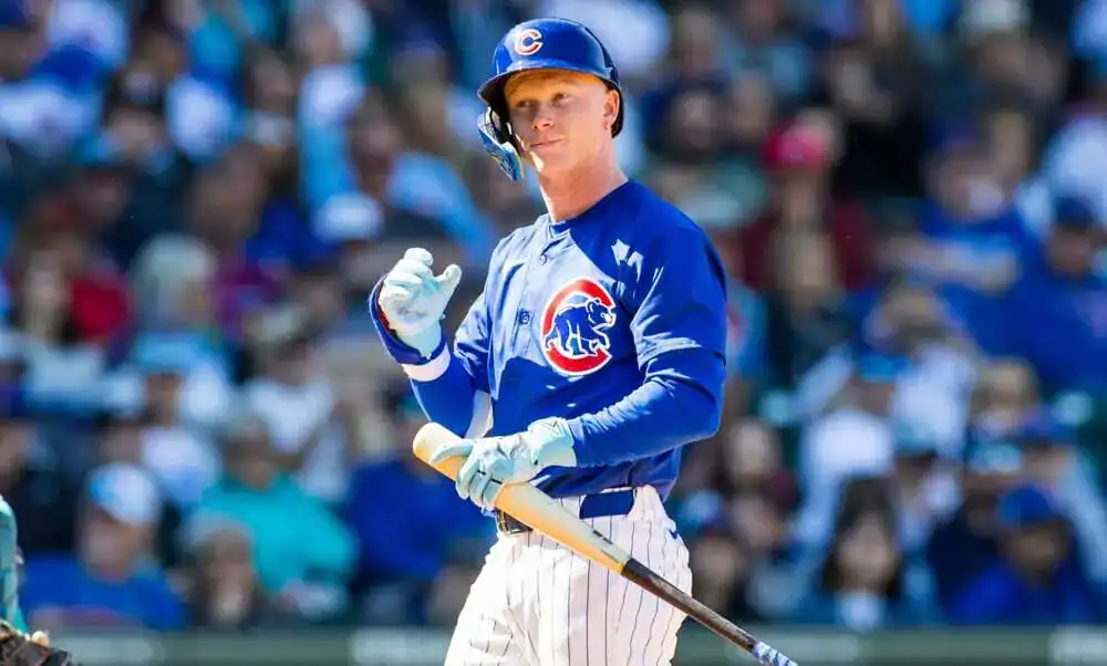 New York Yankees vs Chicago Cubs Picks and Predictions July 11th 2025 2 A baseball player in a blue Chicago Cubs uniform holds a bat and gestures confidently in front of a cheering crowd.