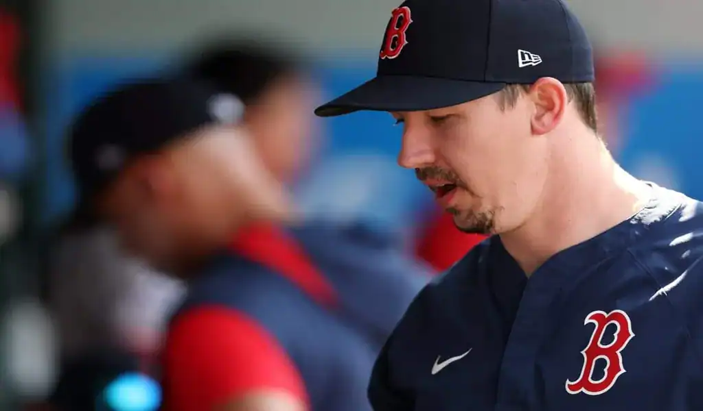 Boston Red Sox player focused in the dugout during a game against the Philadelphia Phillies
