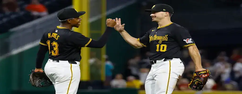 Pittsburgh Pirates vs Detroit Tigers Picks and Predictions July 21st 2025 3 Pittsburgh Pirates players celebrating a play on the field