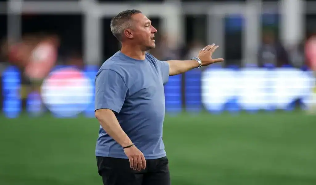New England Revolution coach giving directions during match against Portland Timbers