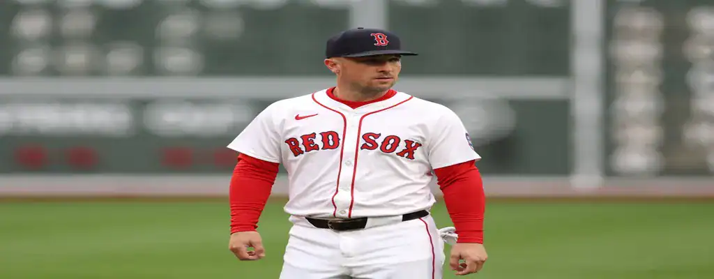 Boston Red Sox player standing on the field during a game