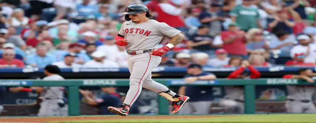 Boston Red Sox vs Los Angeles Dodgers Picks and Predictions July 25th 2025 3 Boston Red Sox player scoring a run during a game with the crowd cheering
