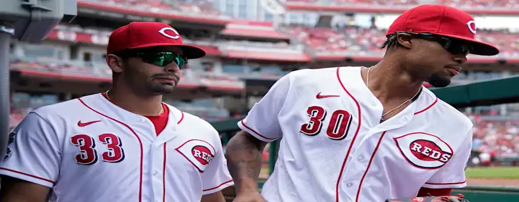 Cincinnati Reds vs Tampa Bay Rays Picks and Predictions July 25th 2025 3 Cincinnati Reds players staying focused in the dugout before the game