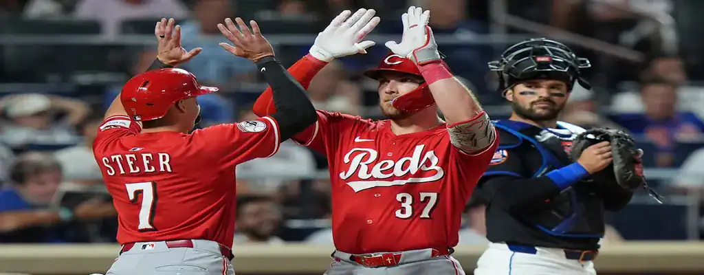 Washington Nationals vs Cincinnati Reds Picks and Predictions July 21st 2025 2 Cincinnati Reds players celebrating a run during a baseball game