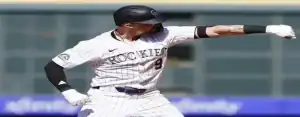 Colorado Rockies player striking a celebratory pose after a key play