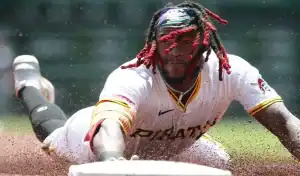 Pittsburgh Pirates player slides headfirst into base during intense MLB matchup vs Seattle Mariners on July 4th 2025
