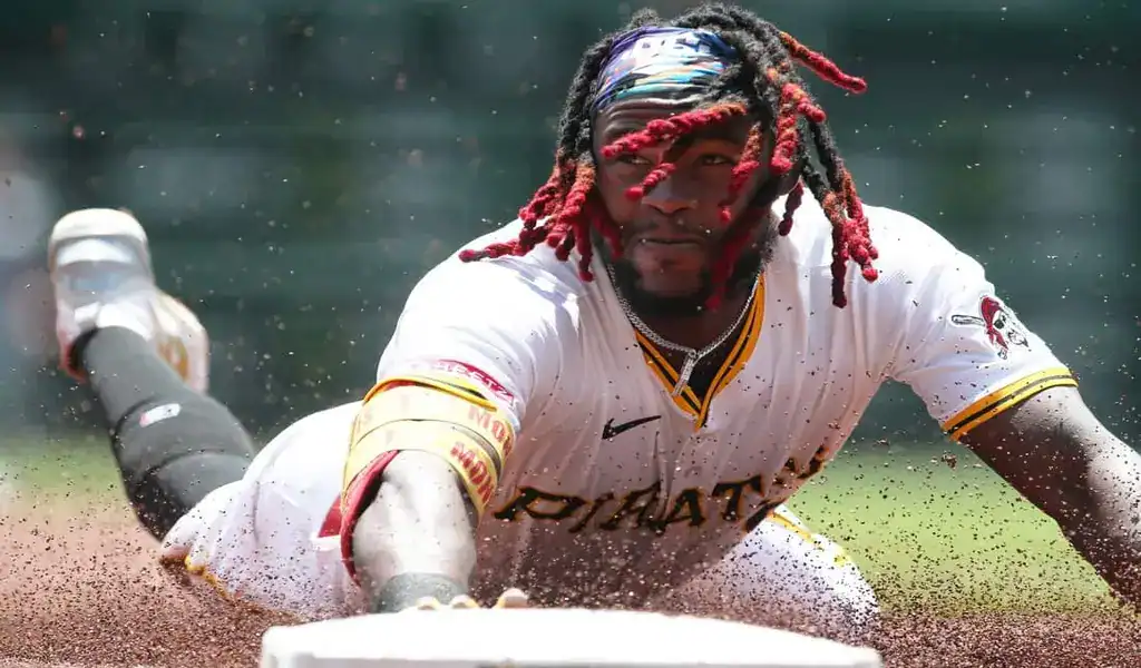 Pittsburgh Pirates player slides headfirst into base during intense MLB matchup vs Seattle Mariners on July 4th 2025