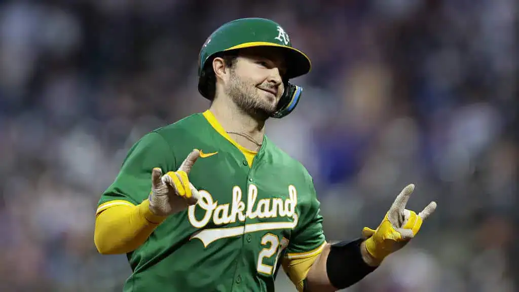 Tampa Bay Rays vs Oakland Athletics Picks and Predictions July 2nd 2025 2 A baseball player wearing an Oakland Athletics jersey gestures enthusiastically during a game, showcasing team spirit.
