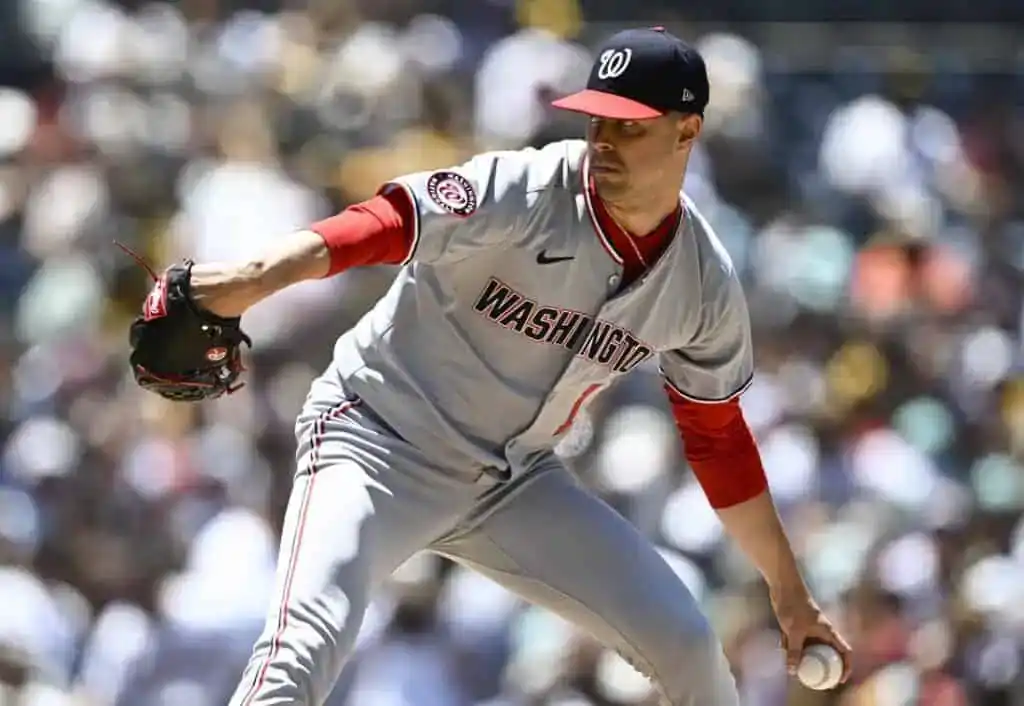 A Washington player catches a ball.