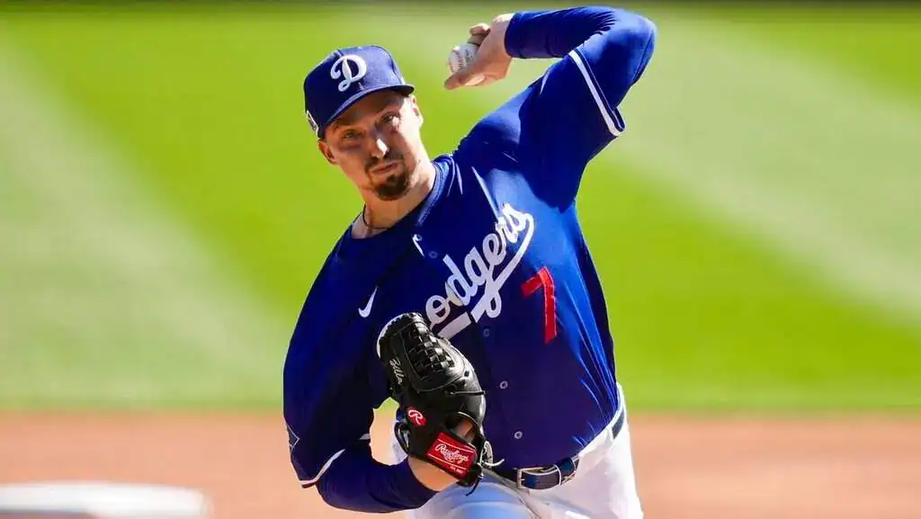 Tampa Bay Rays vs Los Angeles Dodgers Picks and Predictions August 2nd 2025 2 A pitcher in a blue Los Angeles Dodgers jersey prepares to throw a baseball on a bright green field during a game.