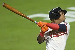 Cleveland Guardians batter following through on a swing