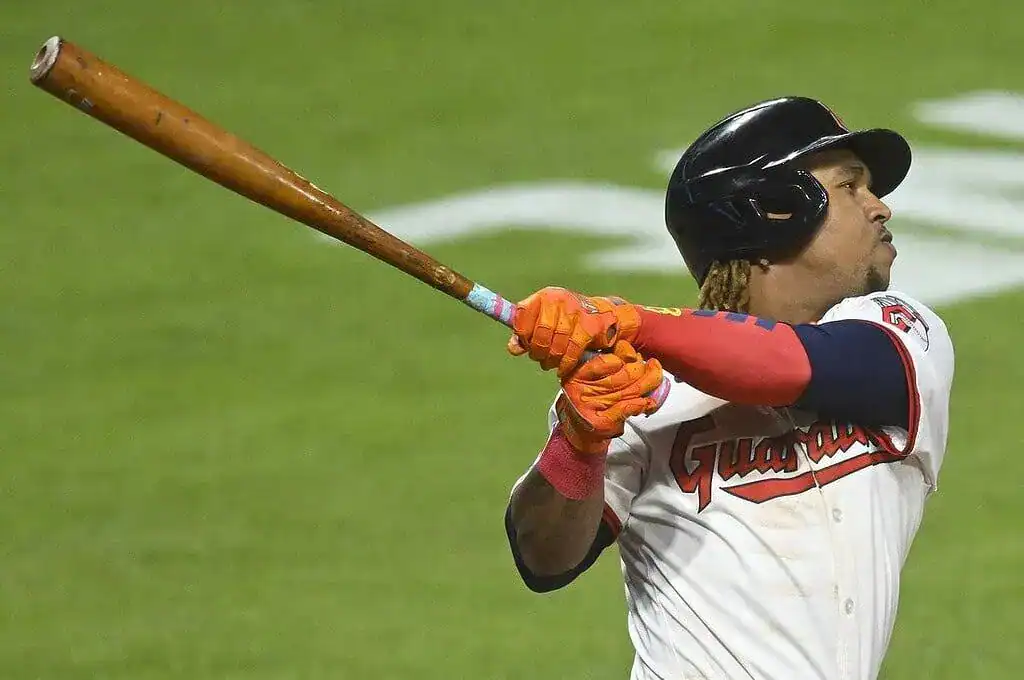 Cleveland Guardians batter following through on a swing