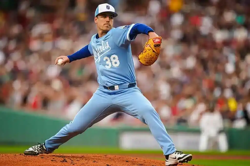 A baseball pitcher in a light blue uniform throws a pitch on a vibrant field, surrounded by a cheering crowd.
