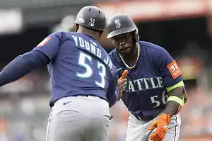 Seattle Mariners players exchanging gestures