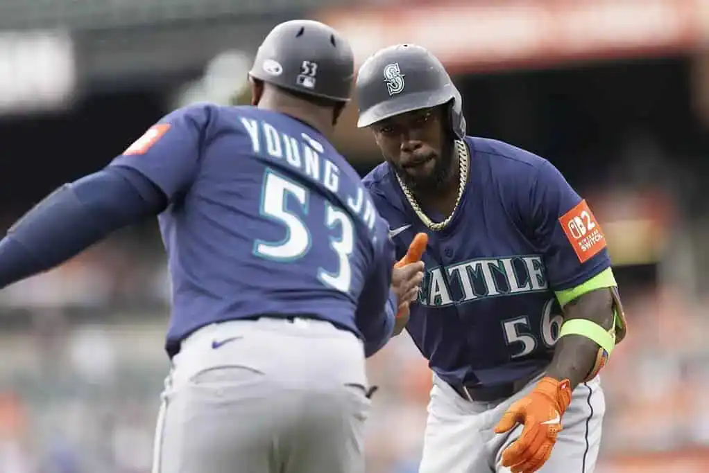 Seattle Mariners players exchanging gestures