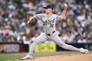 Oakland Athletics pitcher throws from the mound.