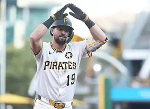 Pittsburgh Pirates player with jersey number 19 making a celebratory gesture after a play.