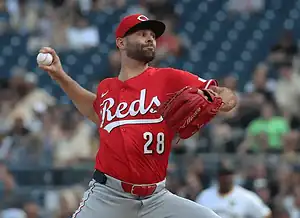 Cincinnati Reds pitcher winds up for a throw.