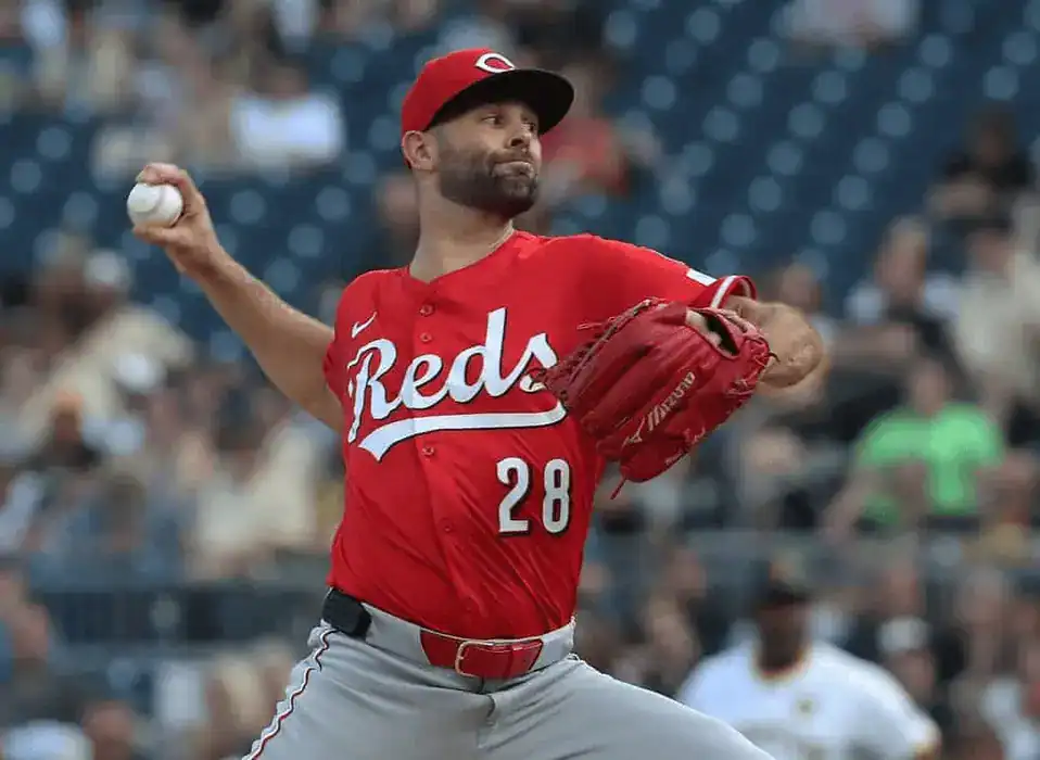 Cincinnati Reds pitcher winds up for a throw.