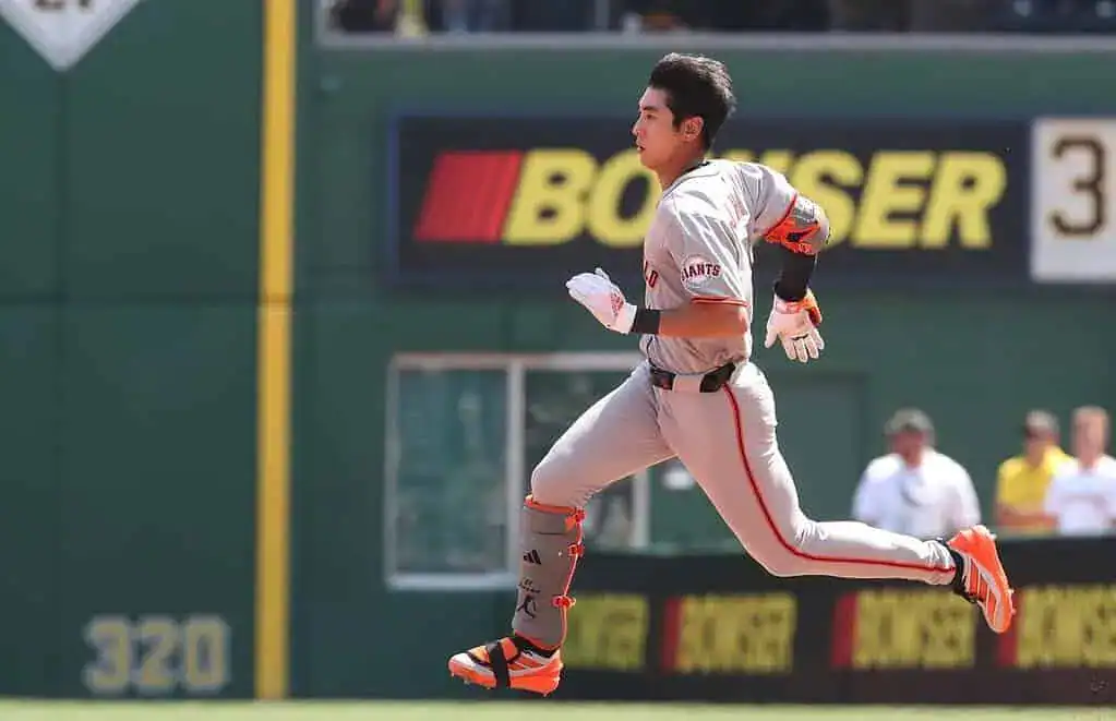 A San Francisco Giants player sprints down the field, showing determination and energy.