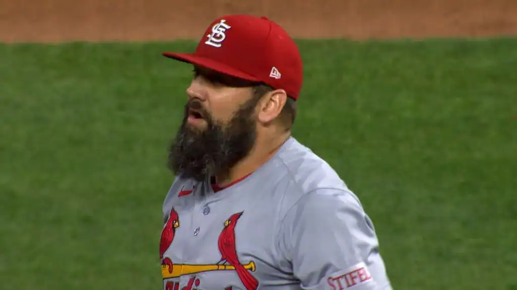 Chicago Cubs vs Baltimore Orioles Picks and Predictions August 2nd 2025 2 A player wearing a red cap and a gray St. Louis Cardinals uniform stands on a baseball field, showcasing a thick beard.