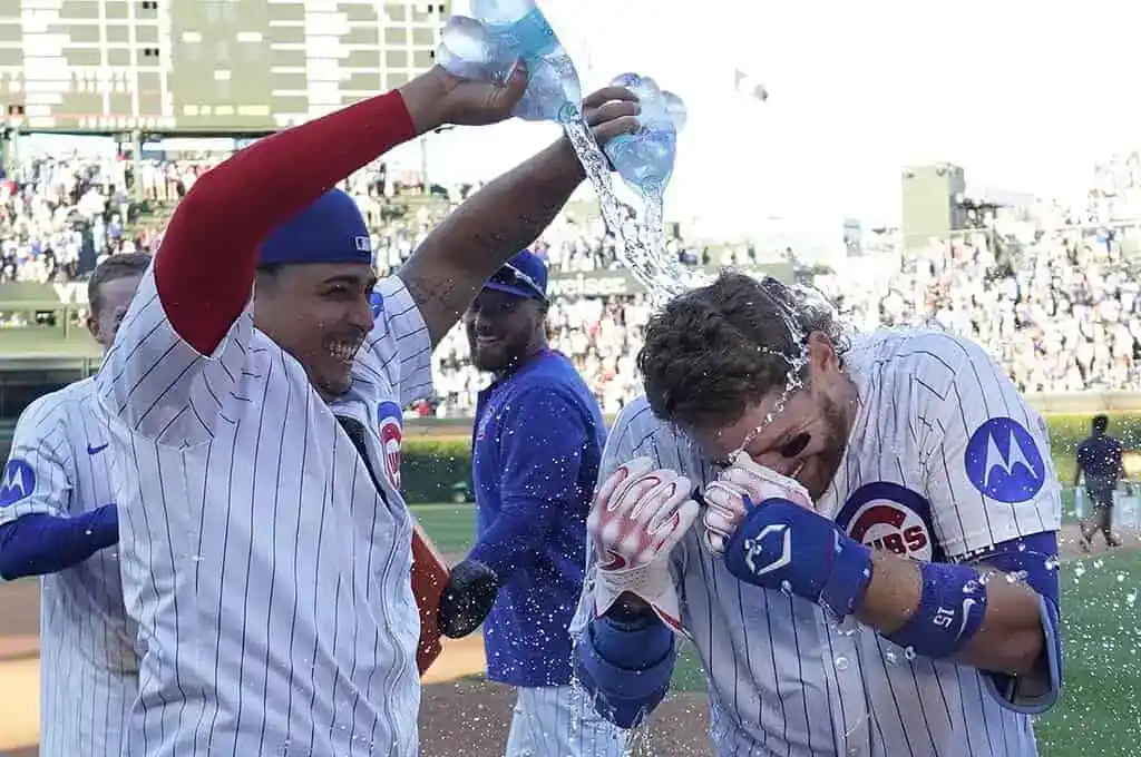 8 CUBS PLAYERS CELEBRATING