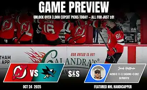 A hockey team in red jerseys celebrates on the bench during a game preview for the Devils vs. Sharks on October 24, 2025.