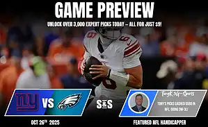 A football player in a white jersey prepares to pass the ball, with promotional text for an upcoming game between the Giants and Eagles.
